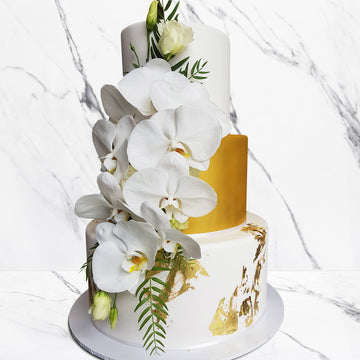 Fondant covered wedding cake – 3 tier gold shimmer and gold spec