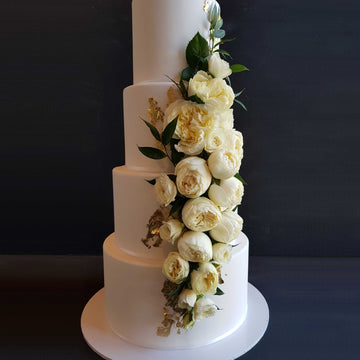 Fondant covered wedding cake4 tiers increased height 23ct gold leaf detail