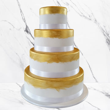 Fondant covered wedding cake – hand-painted gold shimmer