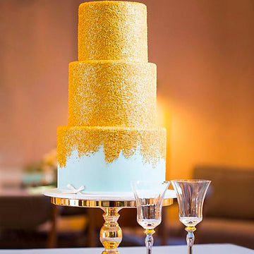 Fondant covered wedding cake baby blue 3 tier cake covered in gold shimmer sanding sugar