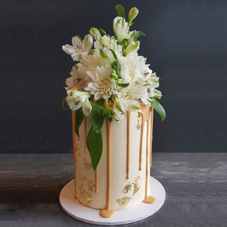 White choc ganache cake with caramel and florals