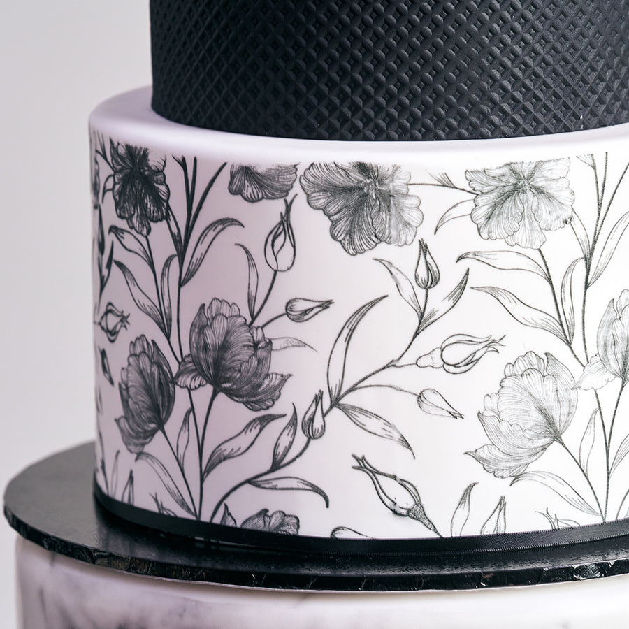 Fondant covered cake - 3 tiers with waffle cone details and screen print floral design