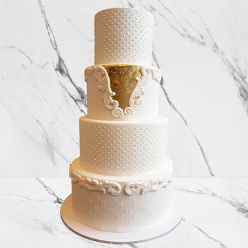 Fondant covered wedding cake – 4 tiers increased height with piped details and 23ct gold leaf