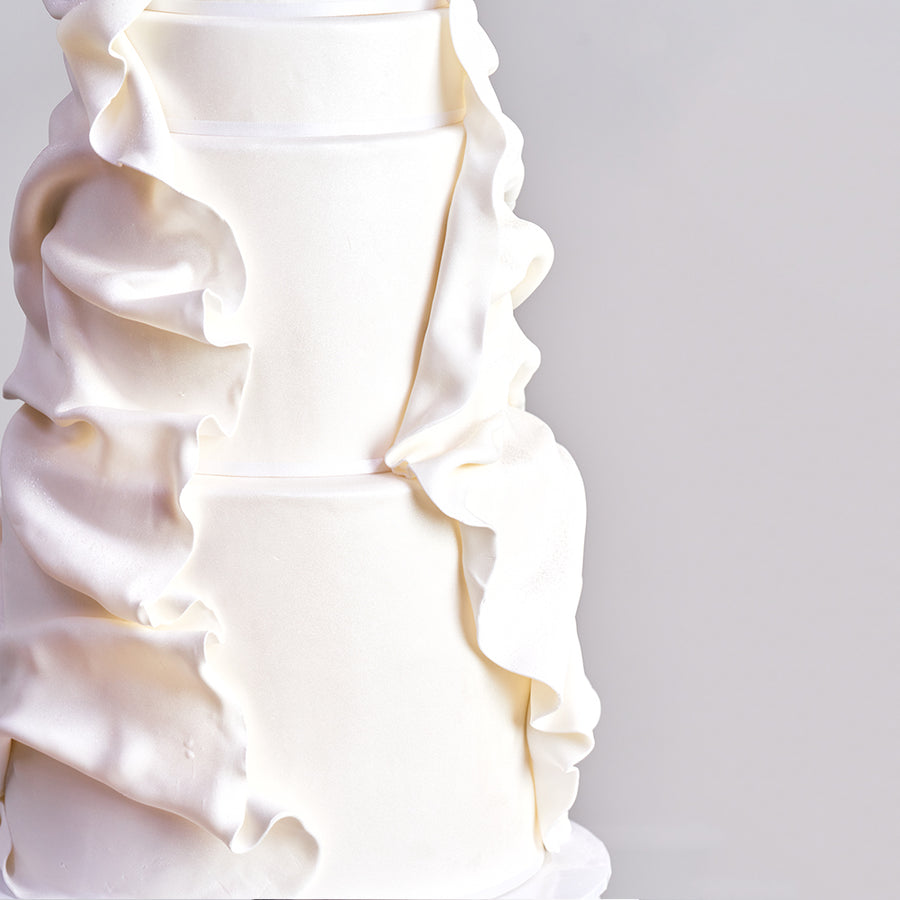 Fondant covered cake - 4 tier elegant design with draped sugar fondant